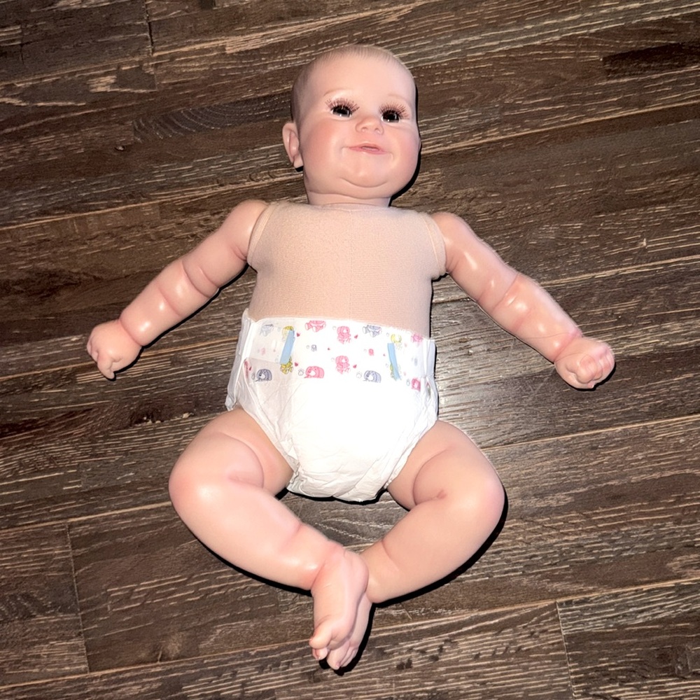 Realistic Baby Doll ( comes with stroller)